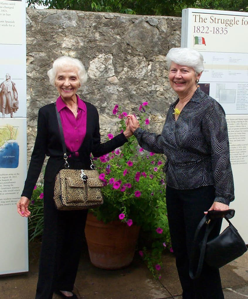 Helen Wright James & Shirley Hamilton McKellips at the story wall in the Alamo Complex